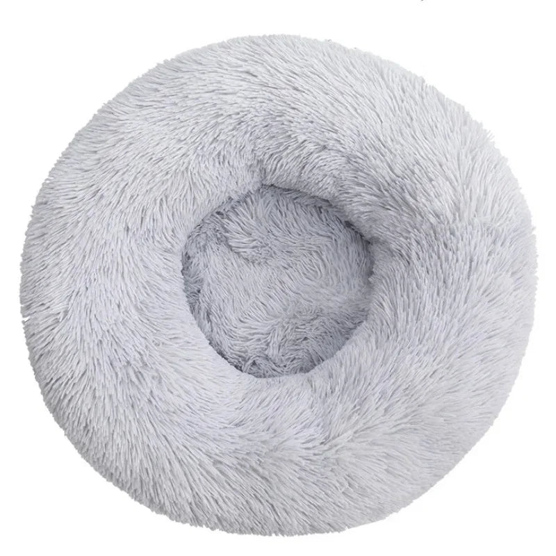 Light gray calming dog bed with plush raised rim, top view