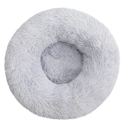 Light gray calming dog bed with plush raised rim, top view