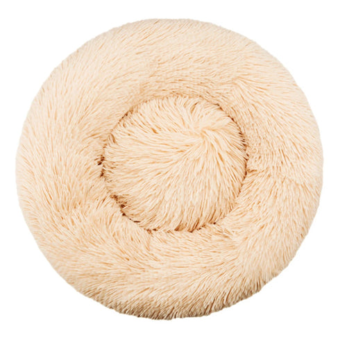 Beige calming dog bed with raised rim, top view showing plush faux fur