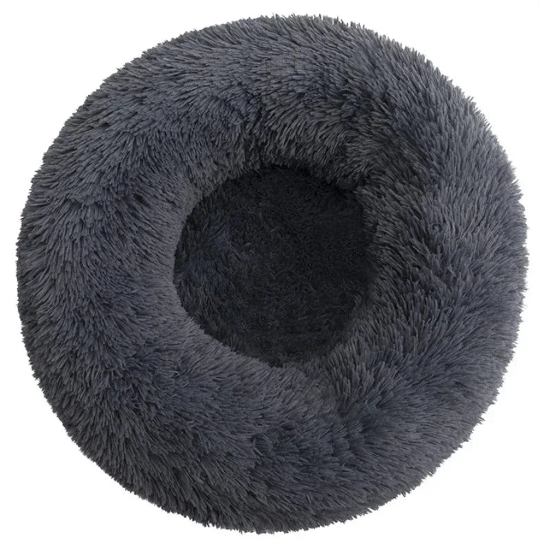 Gray calming dog bed with raised security rim and cushioned center